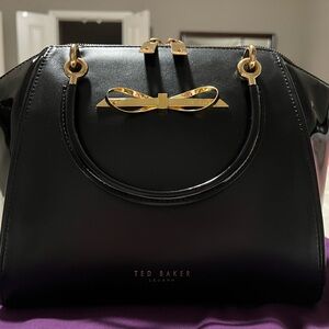 Ted Baker Black and Gold Satchel with Bow Embellishment